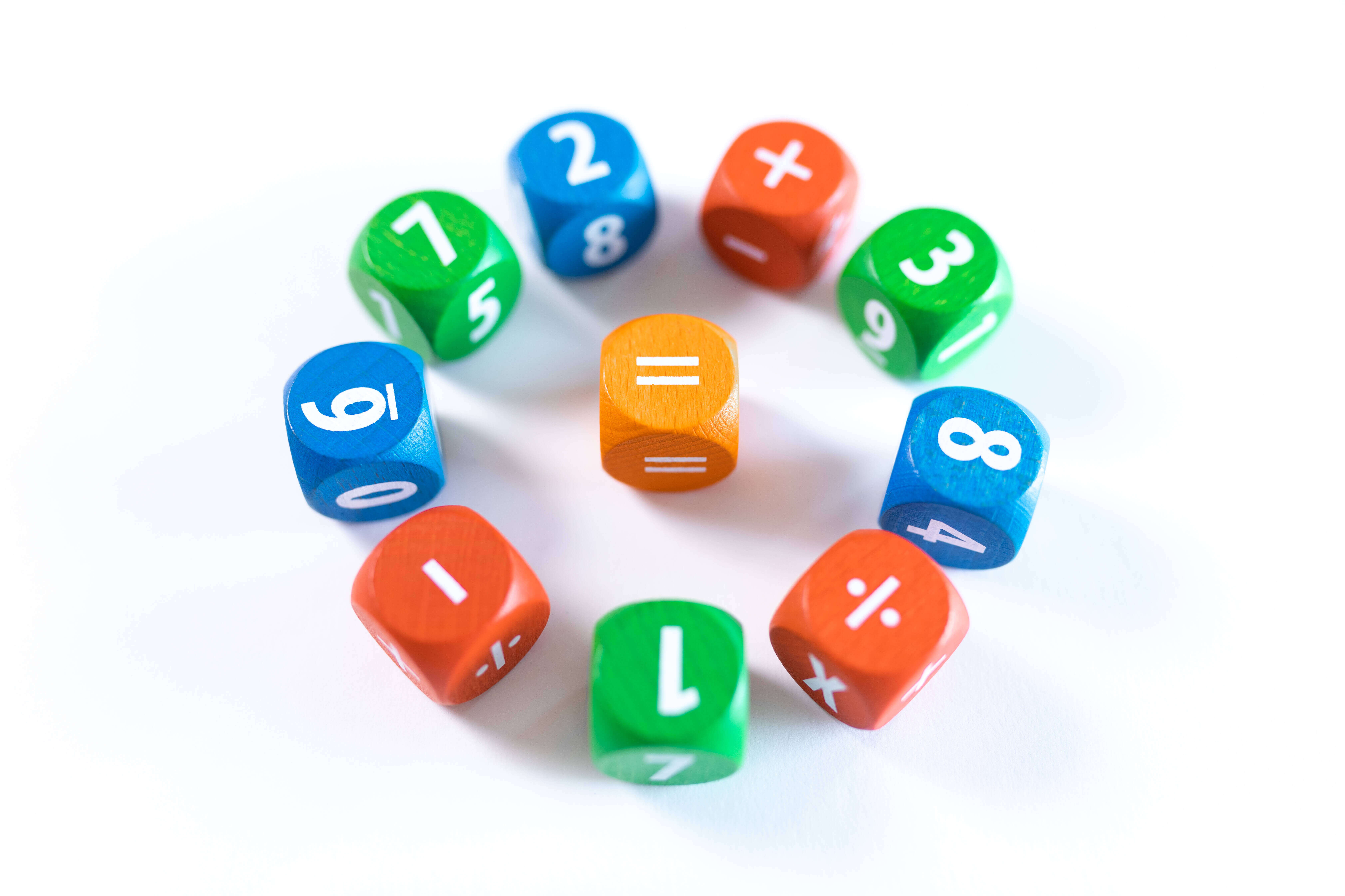 Make math fun with these colored dice with numbers and symbols