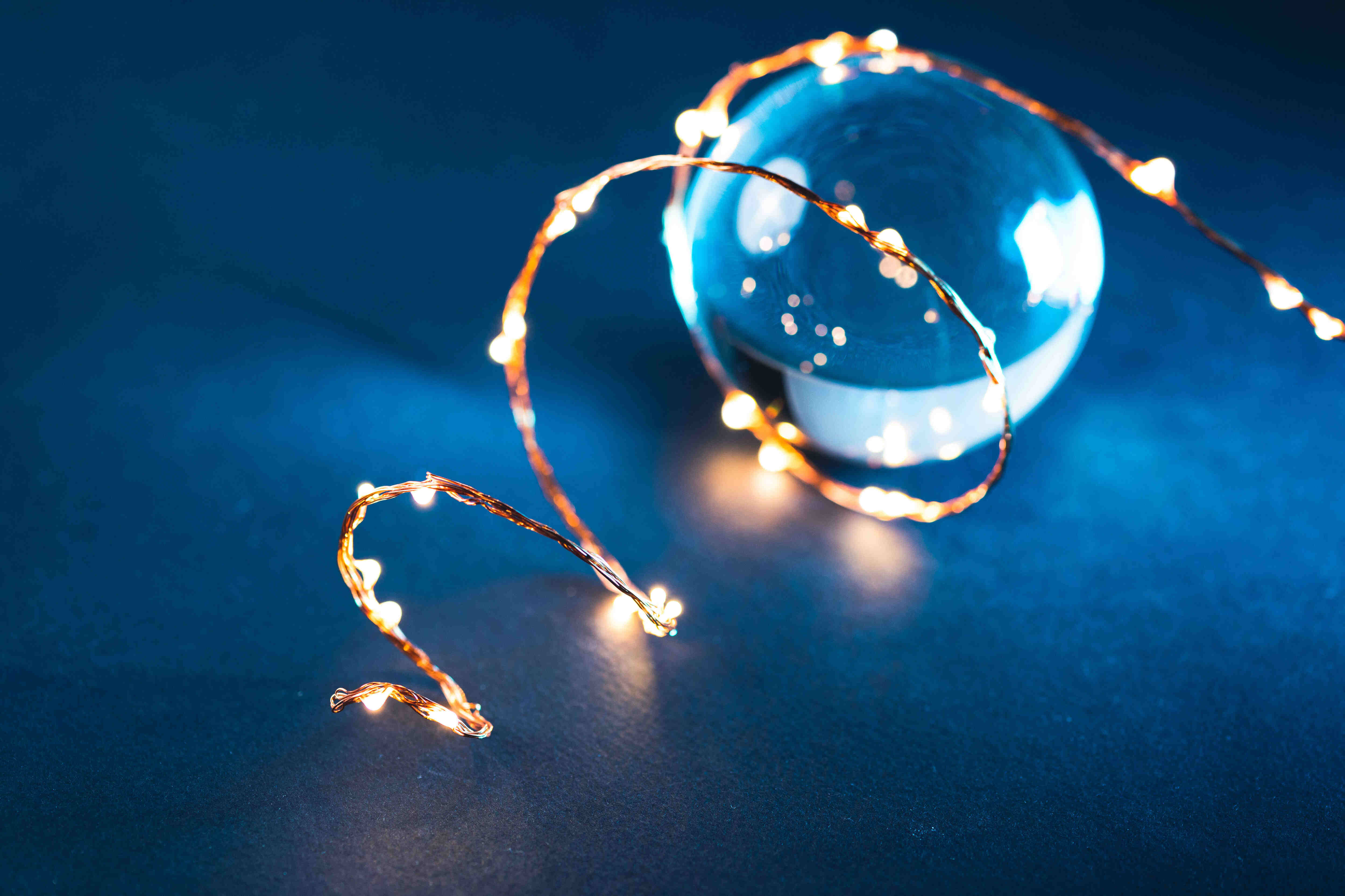 Incorporate some winter wonder by using photos of a glass ball with fairy lights