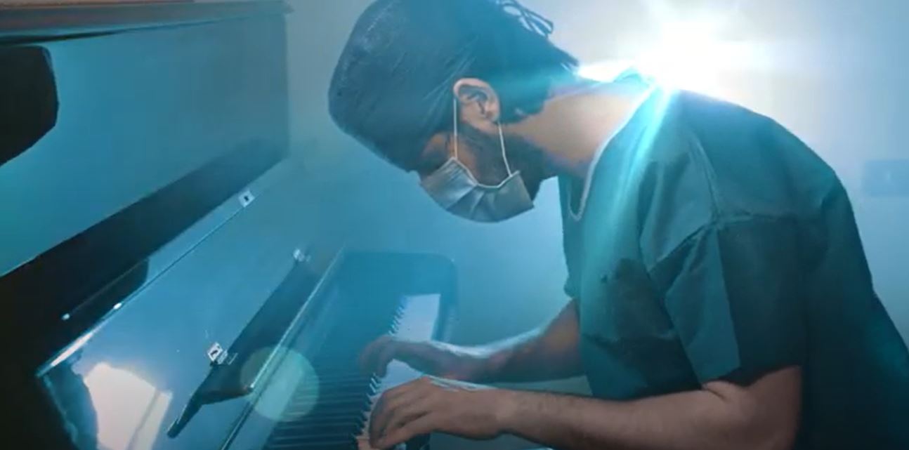 Medical doctor playing the piano free stock video